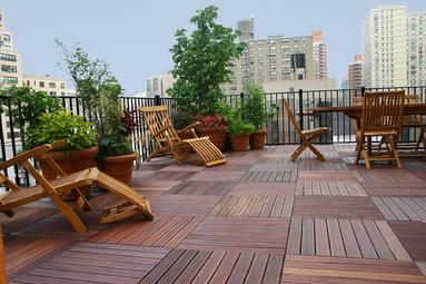 Bison adjustable pedestals support elevated Ipe wood tiles